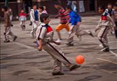 During recess, all of the children at the school swarmed the courtyard to play a complex game of football.: by timothybrooks, Views[350]