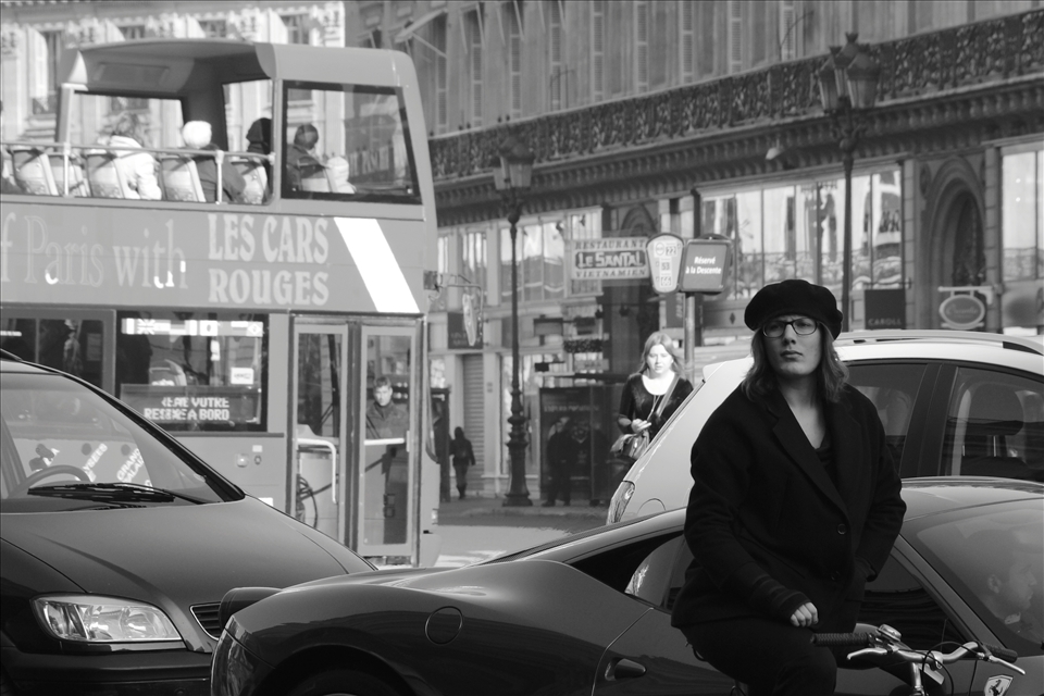 Curiosity.  A woman strikes curios pose as she pretends to have not seen my came