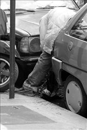 Homeless in Paris. 
A homeless man washes his jeans in the gutter. Homelessness is a major problem in the French Capital and demonstrates the wealth discrepancy present in the city. It was common to see someone sleeping on the footpath, outside designer retail stores.
: by timothyjedwab, Views[851]