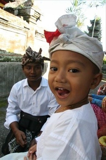 Made (left) and his nephew dressed in traditional temple garb waiting for the procession to begin.