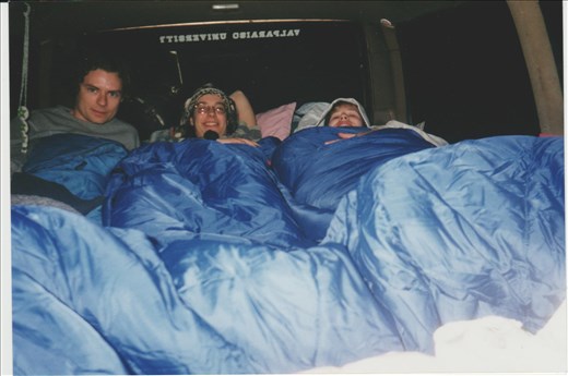 Camping in the car, again.  Four friends traveling in my pimped out van from NY to California.  I'm in the usual feet-sniffing position.