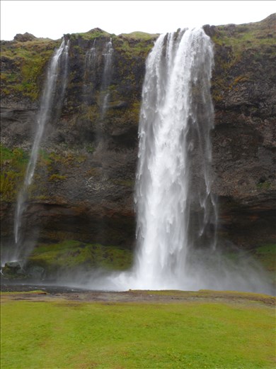 Waterfalls pound and hiss their way to the ocean.  We stand by them to take pictures and are deafened.