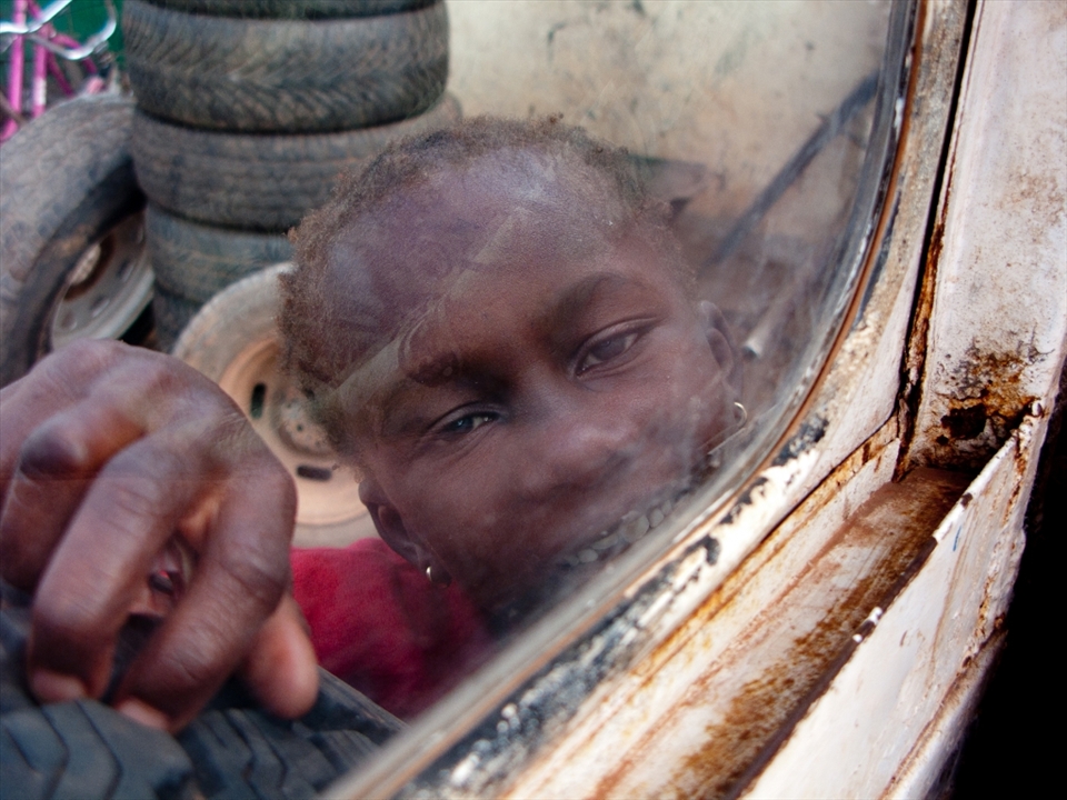 Title : Can You Take me away? 

=============
We were in a car and this little child ran away from his parents and ran into us and offer to take him away. He wanted to be away from pain of being so poor that he can't have enough to eat. 