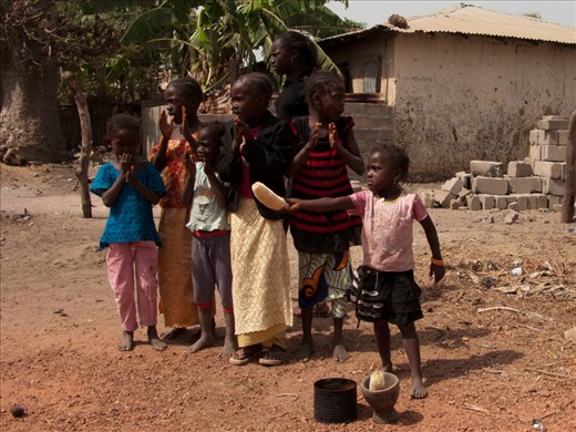 Title : Buy My Stuff Tourists! 
-----------------------
That's my favorite picture that I took when I traveled to the Gambia.  Everytime I walk pass a group of local people, we received a warm welcome followed by offer to a products. Once we clearly show no interest of purchasing, this little girl showed a anger to us. 
