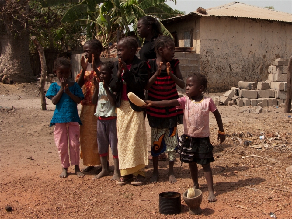 Title : Buy My Stuff Tourists! 
-----------------------
That's my favorite picture that I took when I traveled to the Gambia.  Everytime I walk pass a group of local people, we received a warm welcome followed by offer to a products. Once we clearly show no interest of purchasing, this little girl showed a anger to us. 