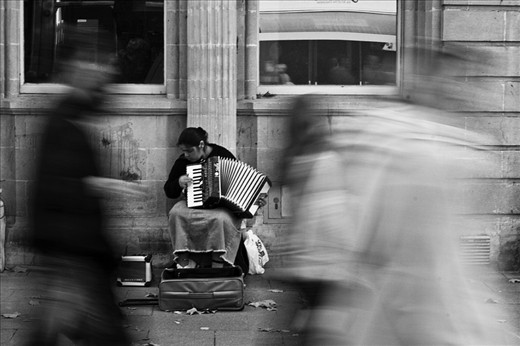 Title : Too Busy to admire
==============
now, I have travelled to a centre of the city where richer people live. They are too busy passing by and minding their business and forget to admire how amazing this musician sounds. 

 