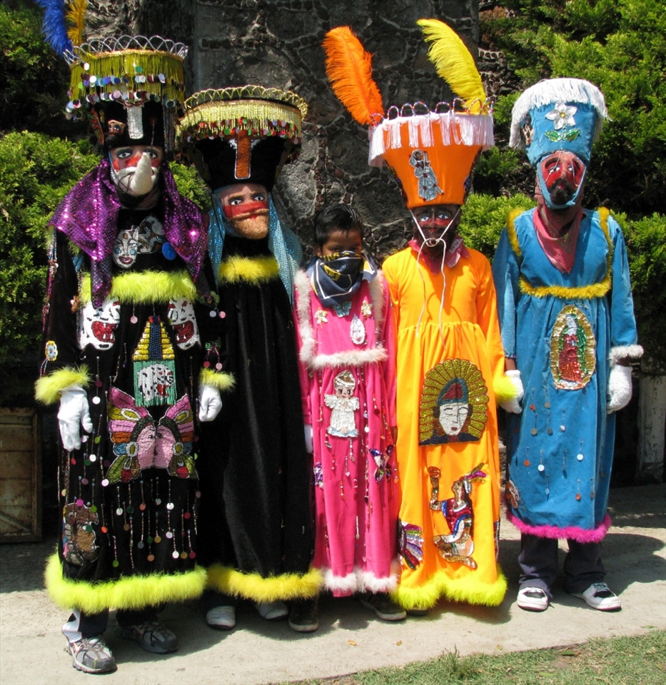 'Chinelos' preparing for the dance outside the local church.