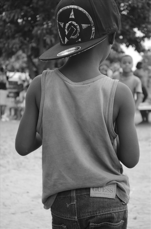The boys were a bit aloof, and it took me a while to be accepted into their club. They have special handshakes and always want to cool. This boy is wearing a volunteer's hat and pair of donated Guess jeans. In many ways, South Africa is a country caught in limbo between two worlds. Many people struggle to pay for food or clothes; however, they also have cell phones and Facebook. I found this juxtaposition to be a reoccurring theme throughout my trip: there'd be times when there was no running water, but I still had a wifi connection.