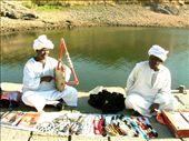 Folklore Instrument 
Music interfere with the locals daily life. this old man promote his goods by playing melodies from heritage using his traditional instrument.   : by toka, Views[408]