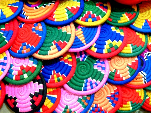 Aswan Color Wheels
Women used to weave this gorgeous plates in cheerful colors from the past and till now days still keeping this heritage and use it when serving under hot pots and some times use it also as a wall decoration.

