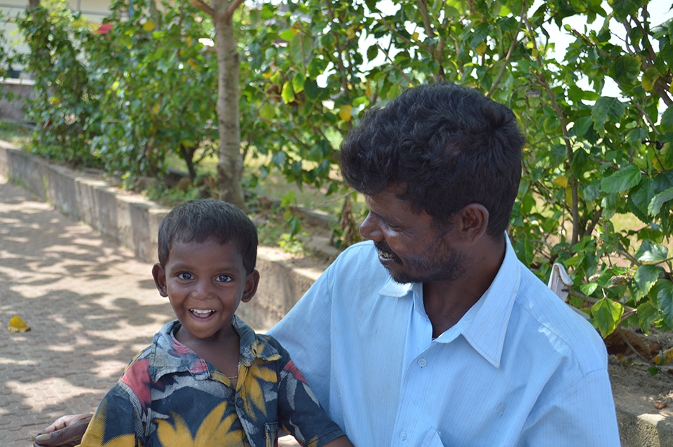 A humble homeless man. What striking eyes his son has!