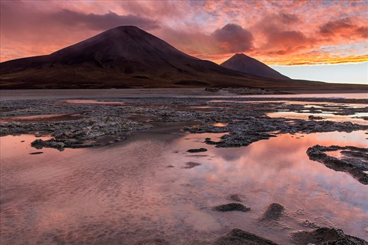 Vulcanos Juriques and Licancabur as seen from Laguna Blanca border at sunset 