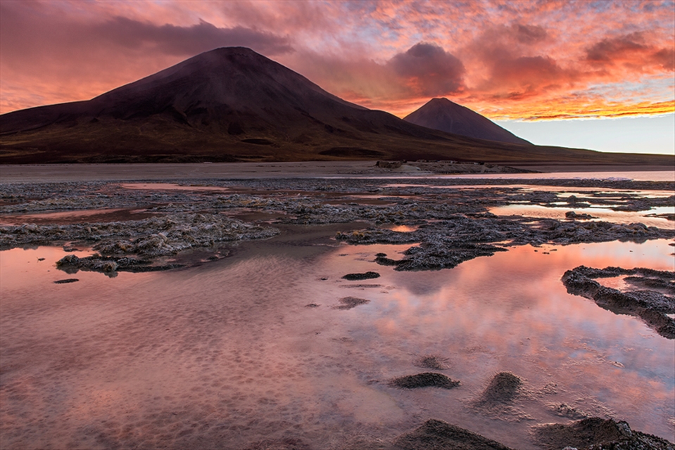 Vulcanos Juriques and Licancabur as seen from Laguna Blanca border at sunset 
