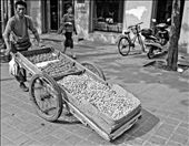 A street vendor walks up and down a main street in Jinan.: by tomwrightphoto, Views[228]