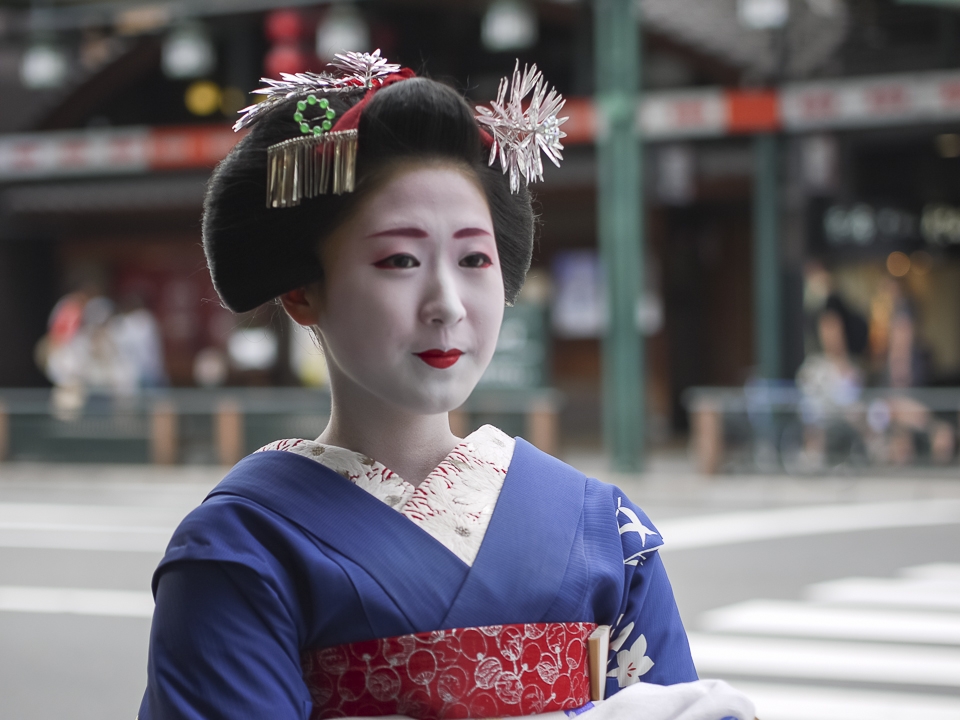 Geiko and maiko stand at the crossroads between past and present. Given the rigors of the profession and its adherence to customs that become increasingly outdated with each generation, the modern-day geisha is fast approaching extinction: at its peak, the sisterhood was 80,000 members strong; today in Kyoto, there are fewer than 300 working geisha, half of whom are located in Gion. It is unclear what the future may hold, but these geisha, already standing on the lip of time, may all too soon join the ranks of those no longer of this world and spoken of only as myth.