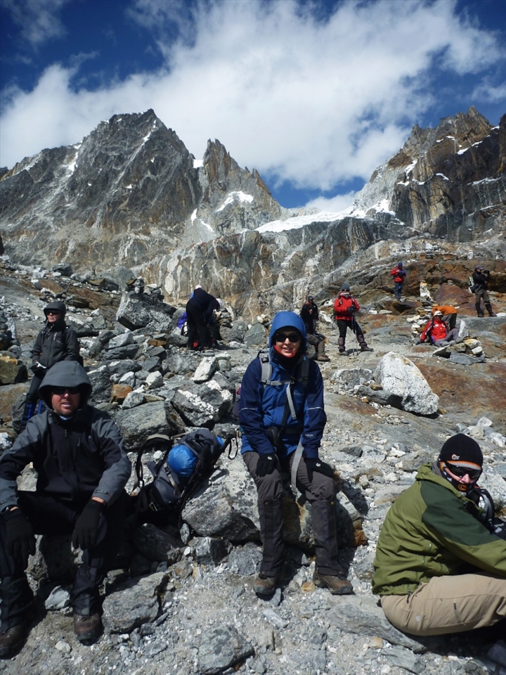 The rough terrain makes for a difficult descent, but a well earned break makes it all worthwhile.  My trekking companions taking a break after the descent from Cho La Pass.  