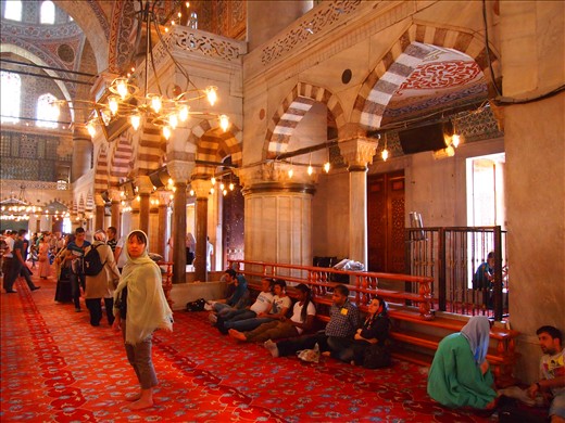 women don't pray in the main area instead they pray at the back