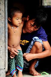 A child is lovingly dressed by her father after a bath: by travellaos, Views[2453]