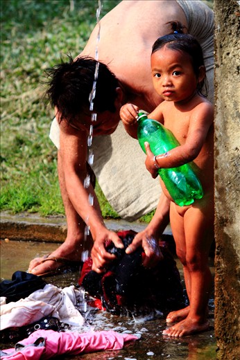 Bathing children and washing clothes are routine by fathers