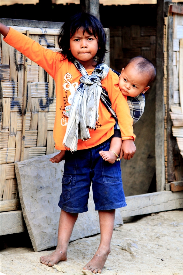 Young children not attending school look after younger siblings