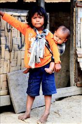 Young children not attending school look after younger siblings: by travellaos, Views[2915]