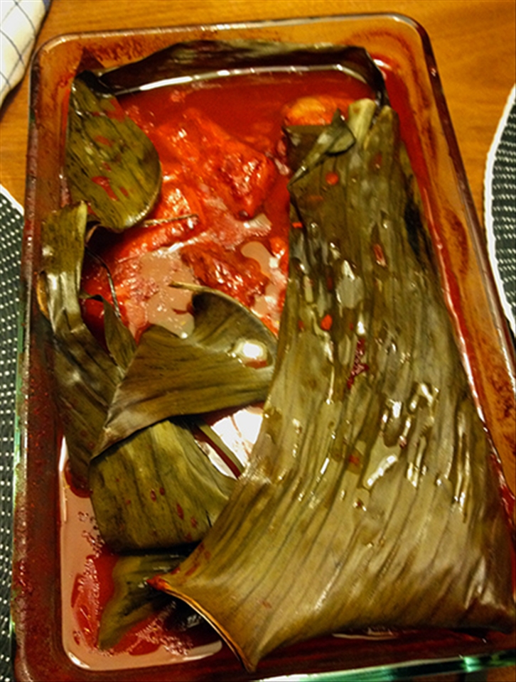 The dish coming out of the oven. Amazing color from the achiote paste.