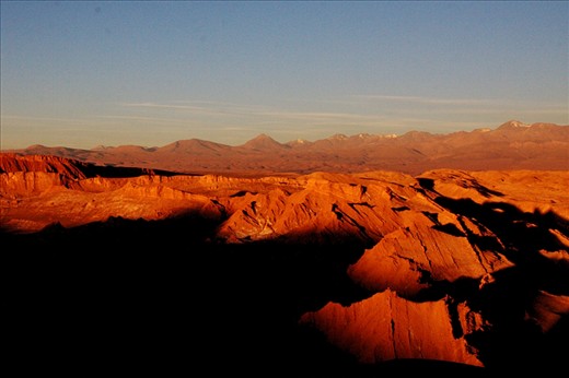 Valley of the moon - Atacama Desert (North of Chile). 
The Atacama is the driest area of the world, raining only once every five years. Then, we can observe the surprising phenomenon called Desierto Florido (flowered desert), and the appearance of a great diversity of flowers. 