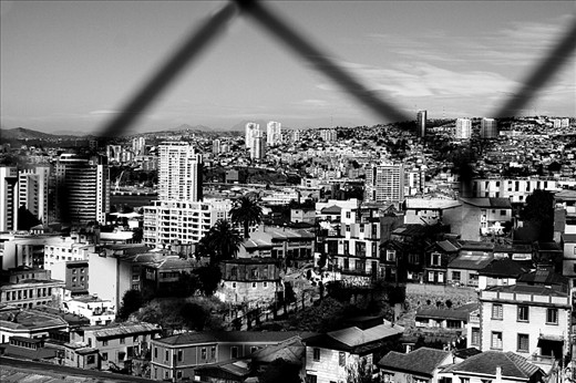 Valparaiso - Chile. 
I took this photo reading an outstanding adventure of Jules Vernes, which reminded  me of the extraordinary sense of freedom and creativity. From this observation point we can discover Valparaiso, city of thousands of colors. However, from a different perspective, here we have Valparaiso in simply in black and white.