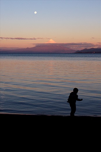 Osorno Volcano – Puerto Varas, Chile. 
The Osorno stands on the East of the Llanquihue Lake as a white pyramid with a mysterious aureole of clouds. A Mapuche legend, an aboriginal community in the South of Chile, says that a malign spirit, El Pillan, is confined in his womb under the ice.