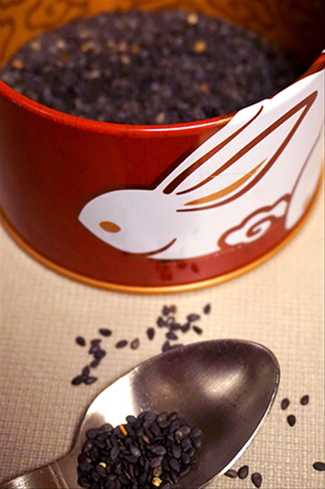 Measuring out the sesame seeds for filling