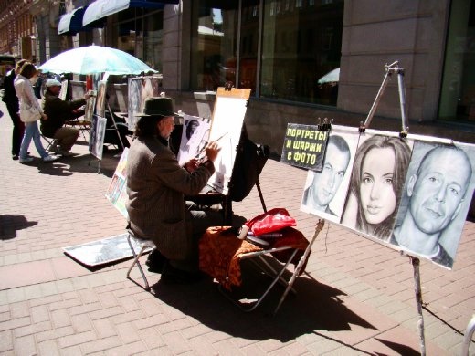 Street artist busy at work Street artist busy at work