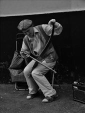 This guy often sits near the metro making music on a saw,: by treefrog, Views[183]