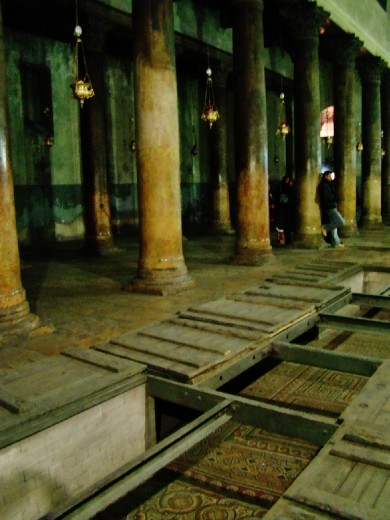 Trap doors in the present floor reveal sections of floor mosaics surviving from the original basilica.