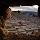Graves fill the side of the hill right next to the city Views[113]