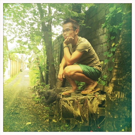 My friend Adrien taking a leisurely break on a pile of bricks (Bali, Indonesia)