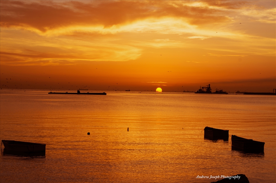 A place where a submarine, fishing boats, and Oil tanker dock