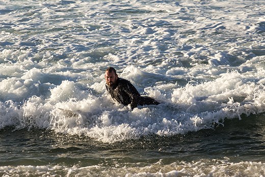 Bringing it in after his morning surf
