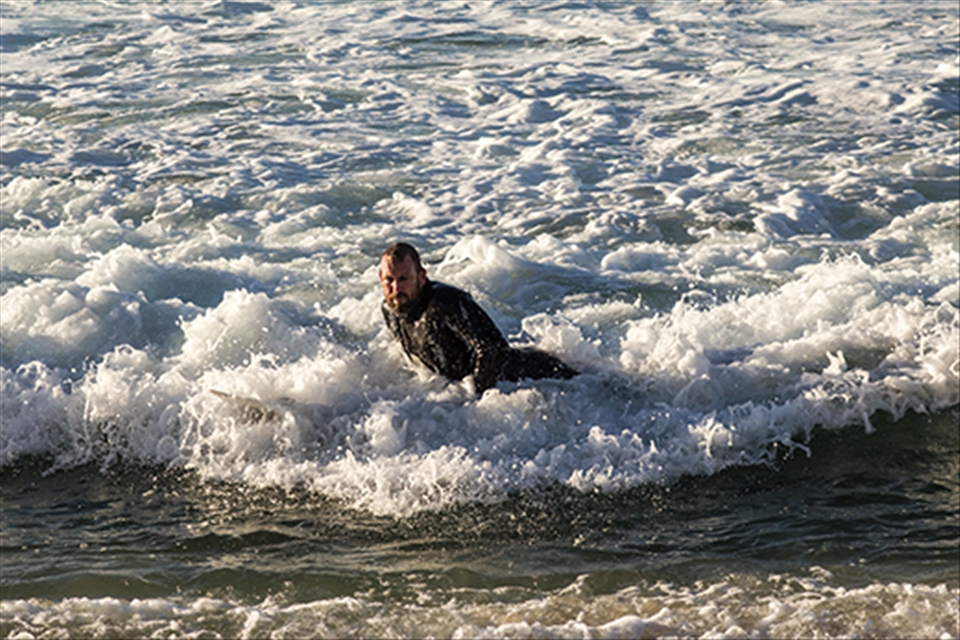 Bringing it in after his morning surf