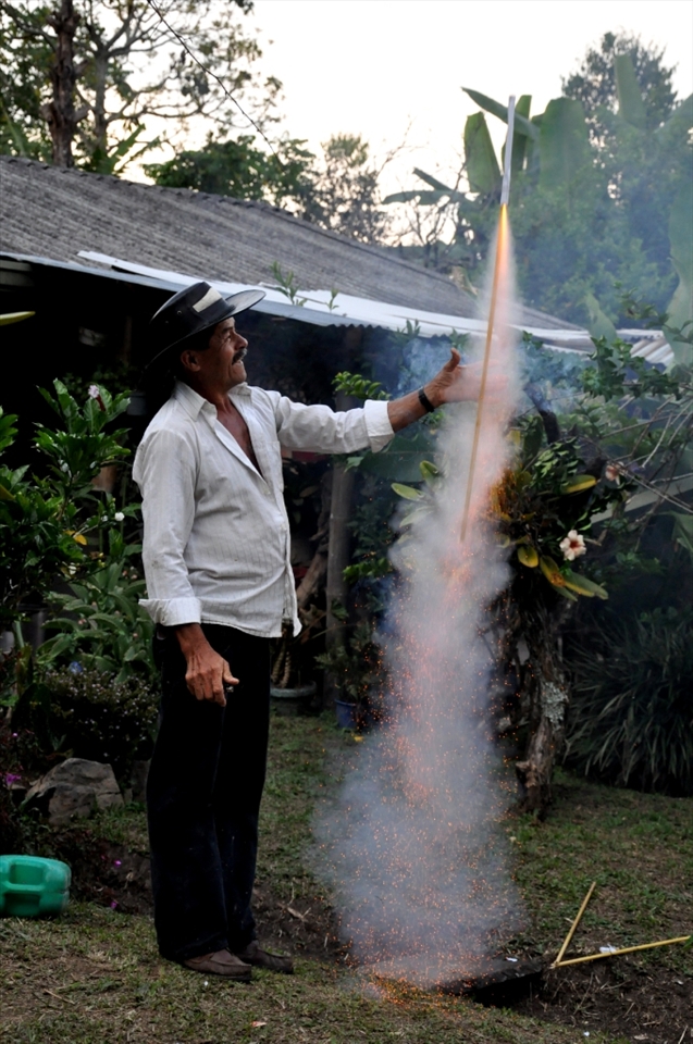 Native of the country celebrating the birthday of his boss with  illegal fireworks