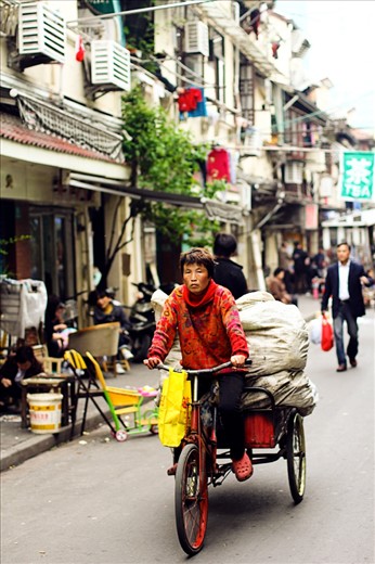 Many workers in China still use bicycles for their work, often these jobs can be quite heavy