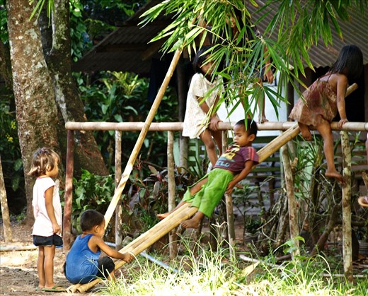 Everywhere is a playground. 
While the old ones are in the field or lake for their livelihood. The kids are out to play and enjoying the sunny afternoon with a makeshift slide made out of bamboo.