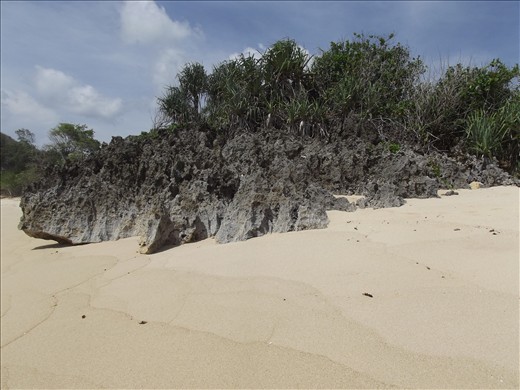 one of the rocks that complement the beauty of the beach.