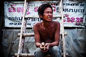 -Master of All I Survey-
In Cambodia we walked through the slums that were nearby the school we were helping at. I had a chat to this guy and asked to take his picture. He lives in the slums and tries to get work day-by-day at construction sites in order to make whatever money he could. Pictured behind him is a pretty standard “wall” of a slum house. It isn’t solid; it’s just an old advertising banner.: by tyson, Views[867]