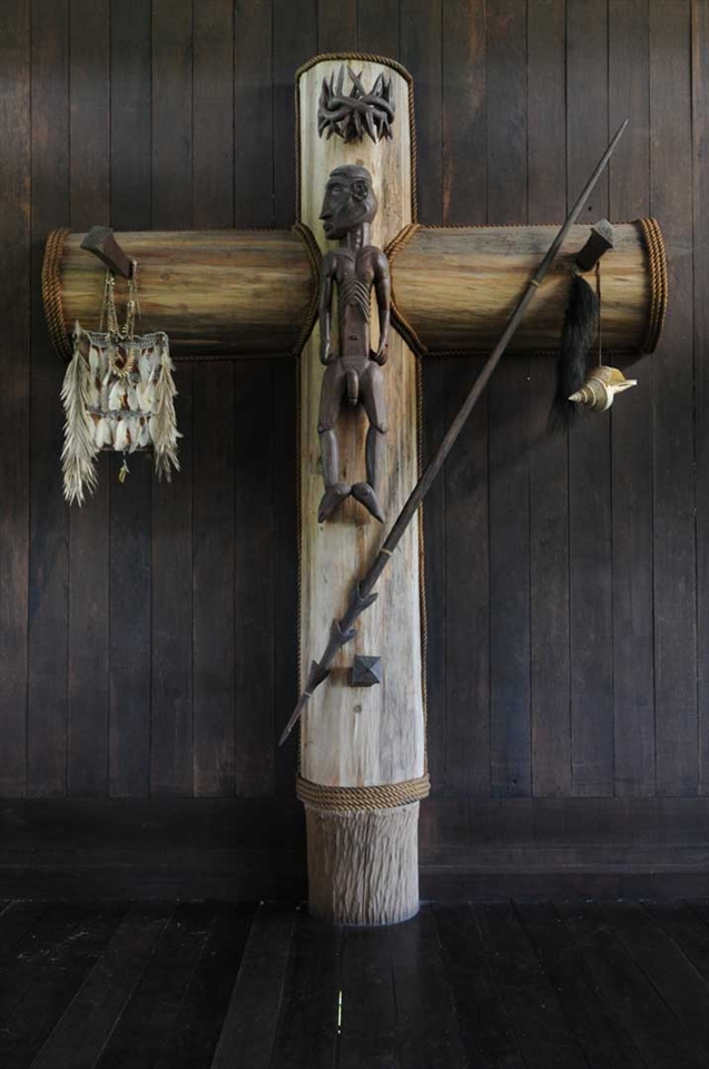 Jesus was black. The cross of Jesus in the village church of Sawa Erma. According to the Asmat tribe, Jesus did not have long hair and he was naked when on the cross. The spear symbolizing that they have left the tribal war. Warfare and headhunting was the forces behind most Asmat tradition.