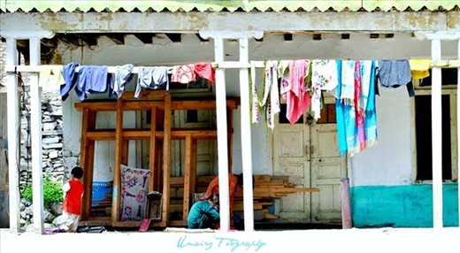 local house with cloths hanging