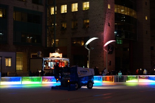 Skaters wait for the Ice Resurfacer(zamboni) to finish so they can skate onto 