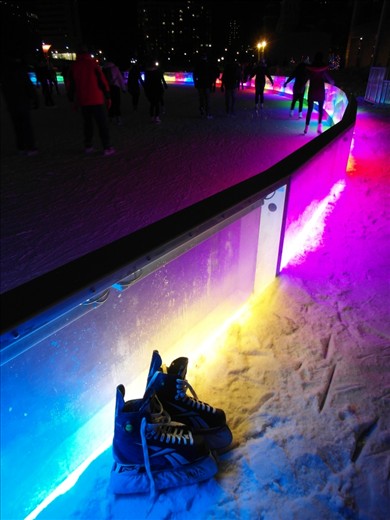 my skates next to the rink while i relax my ankles after a few hours of ice skating