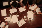 Rainbows: crayons and paper are strewn over the table at a girls' home after dinner, a time to explore creativity and complete homework.: by unumastrum, Views[1420]