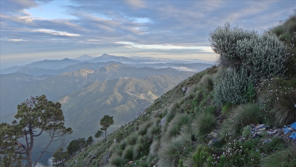 Peering North into Mexico from Santa Maria Volcano at sunrise. (Guatemala)
