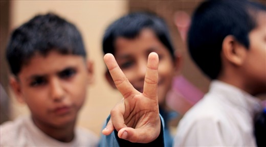 The 'V', a symbol for victory and freedom. A symbol representing overcoming an obstacle and striving to achieve an objective. These kids in this government run school in the slums of Karach, they all want to achieve a certain goal in life. 
